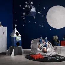 kids room with blue wall and painted with silver moon