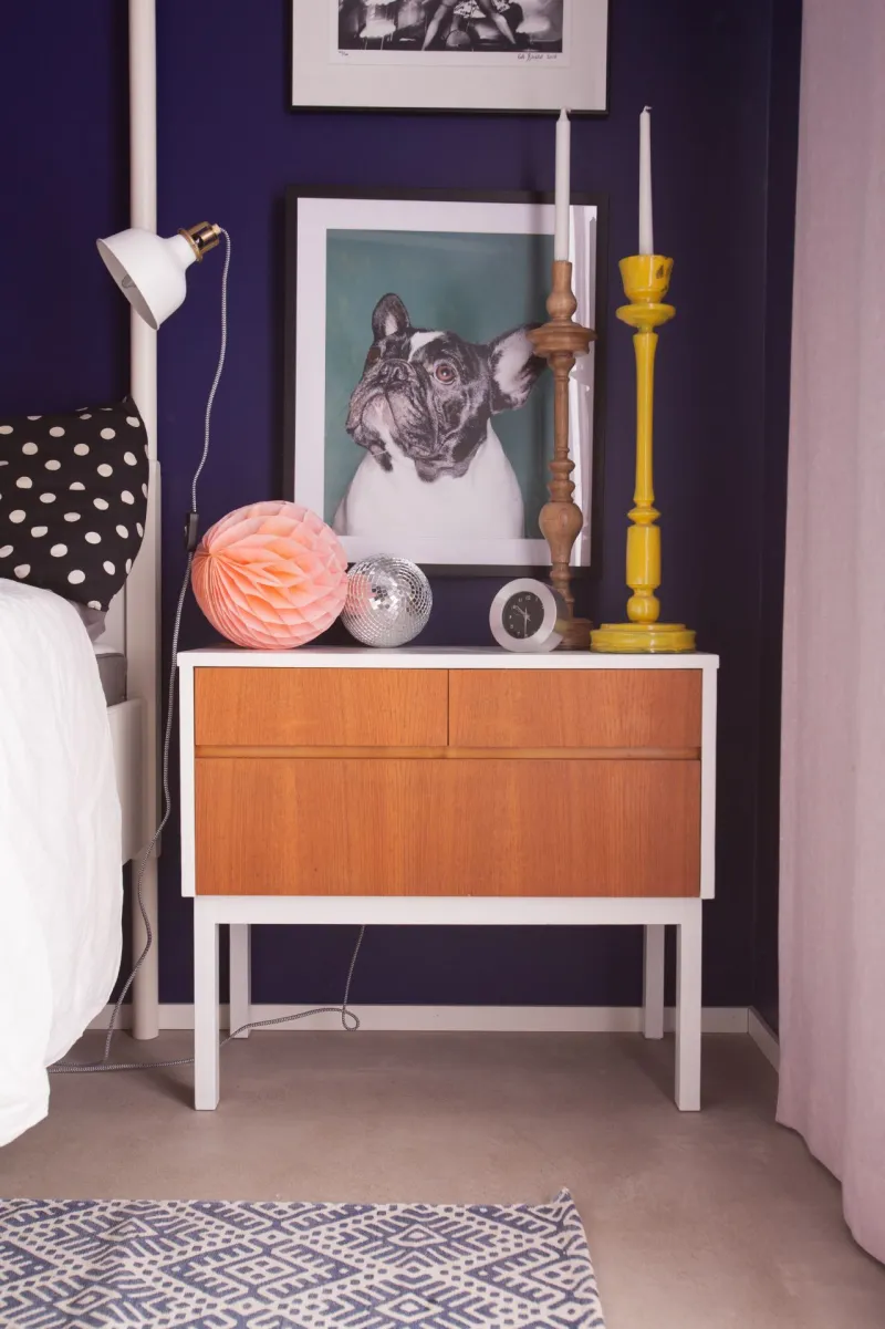 Blue bedroom with a night stand