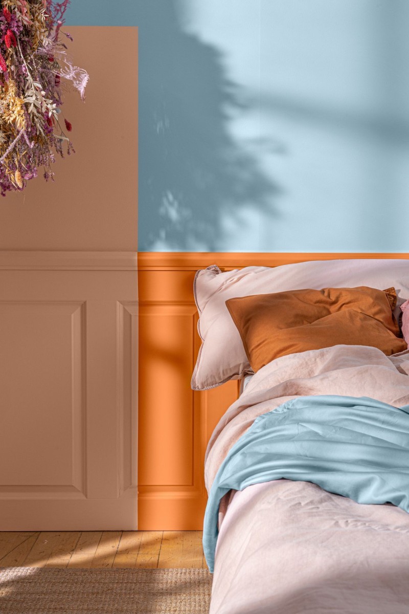bedroom wall with light blue, pink and warm orange colour section