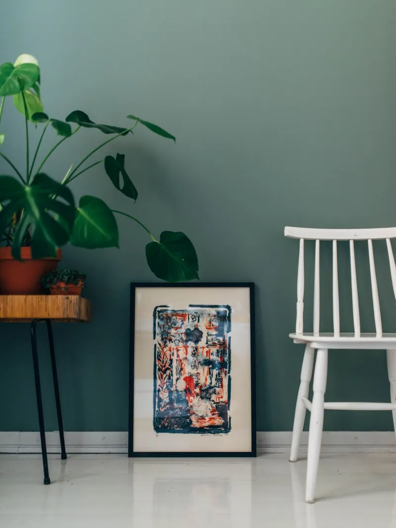 green wall with chair